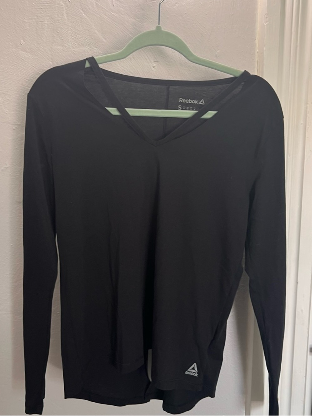Reebok Women’s Black Long-Sleeve V-Neck Top with Subtle Logo